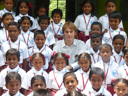 Olivier Soret, president of Humanium, and the children of Annathur school, India